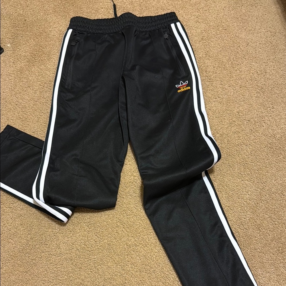 Adidas women’s Black Joggers with White Stripes